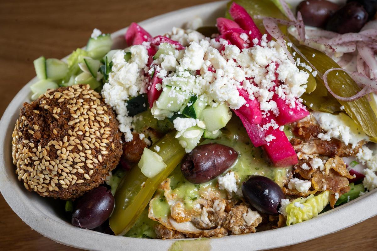 A sesame falafel and the chicken shawarma Bowl at Zhoug Mediterranean, which had a soft opening in the old d’Bronx space at 3904 Bell St., on May 14 in Kansas City.