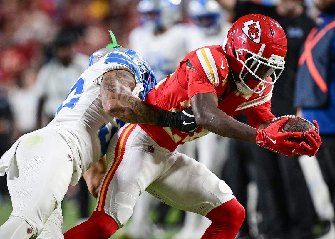 Kansas City Chiefs running back Kareem Hunt (29) tries to break free from the grasp of Detroit Lions safety Brian Branch (32) on a run in the fourth quarter on Sunday, Oct. 12, 2025, at GEHA Field at Arrowhead Stadium.