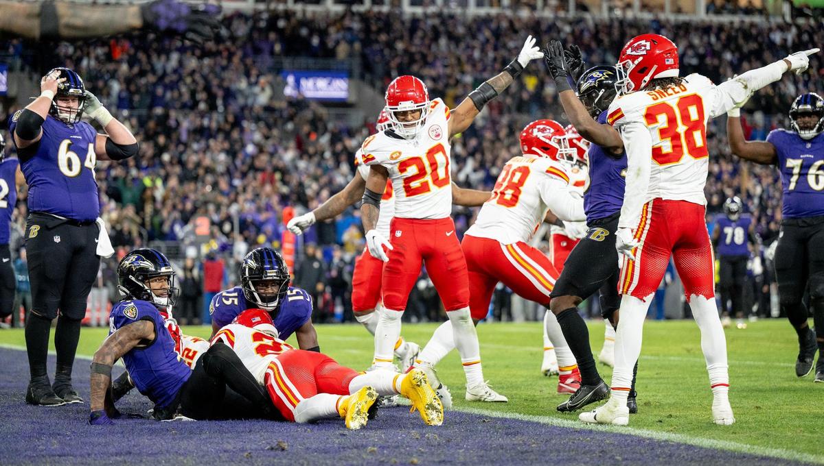 Kansas City Chiefs safety Justin Reid (20) and cornerback L’Jarius Sneed (38) signal a turnover as Baltimore Ravens wide receiver Zay Flowers (4), wide receiver Nelson Agholor (15) and center Tyler Linderbaum (64) react to fumbling the ball on their goal line during the AFC Championship Game on Sunday, Jan. 28, 2024, in Baltimore.