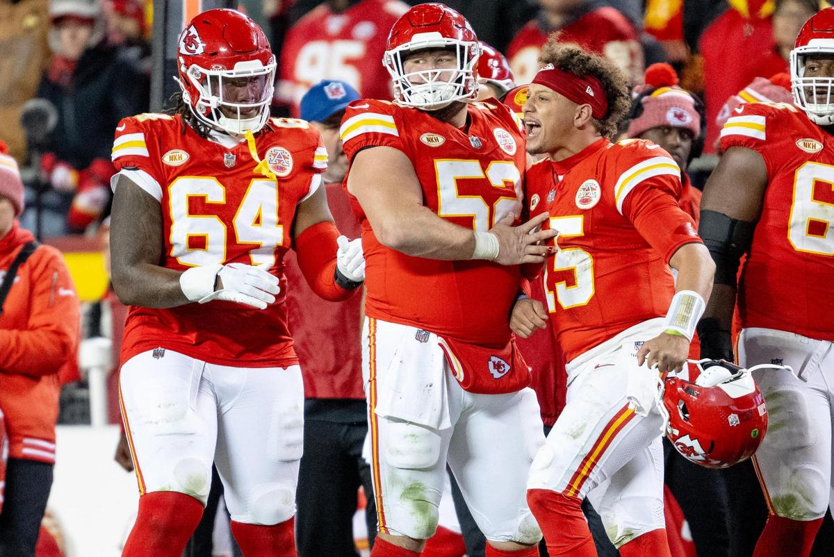 Kansas City Chiefs center Creed Humphrey (52) holds back quarterback Patrick Mahomes (15) as he yells at an official during an NFL football game against the Buffalo Bills on Sunday, Dec. 10, 2023, in Kansas City.