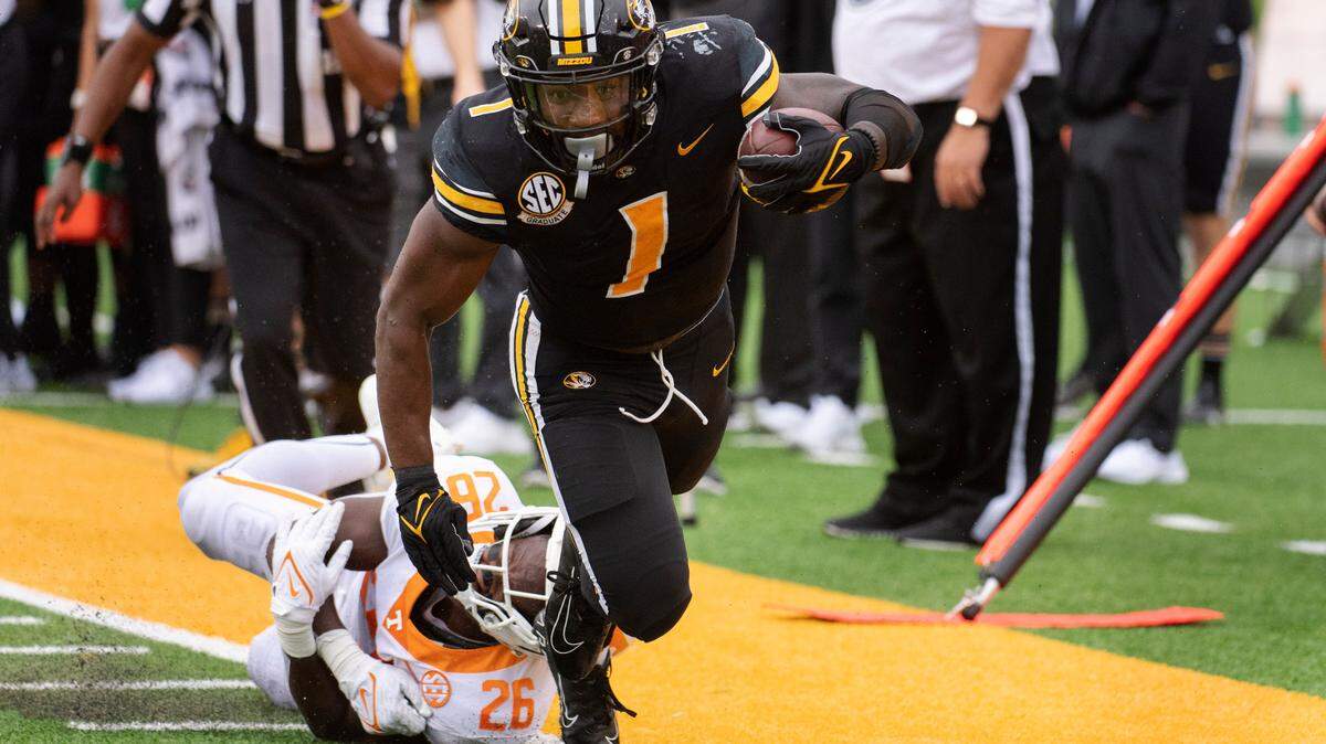 Missouri running back Tyler Badie, right, is tackled by Tennessee defensive back Theo Jackson during the first half of an NCAA college football game Saturday, Oct. 2, 2021, in Columbia, Mo. (AP Photo/L.G. Patterson)