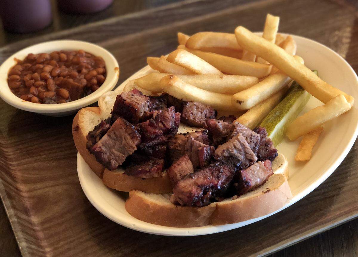 Zarda's Limited Reserve burnt ends are coated in a sweet and spicy dry rub and served open face on white bread with fries.