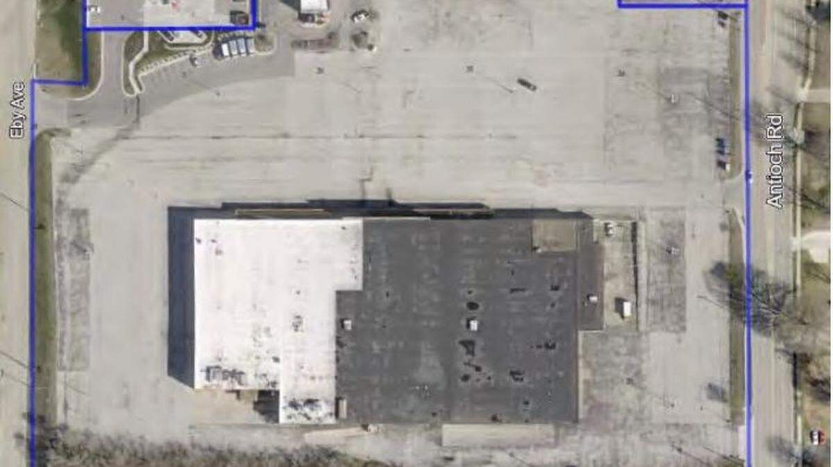 The site of the development has a vacant Kmart and three existing businesses. The proposed development would add four restaurants, two apartment buildings and a retail space.