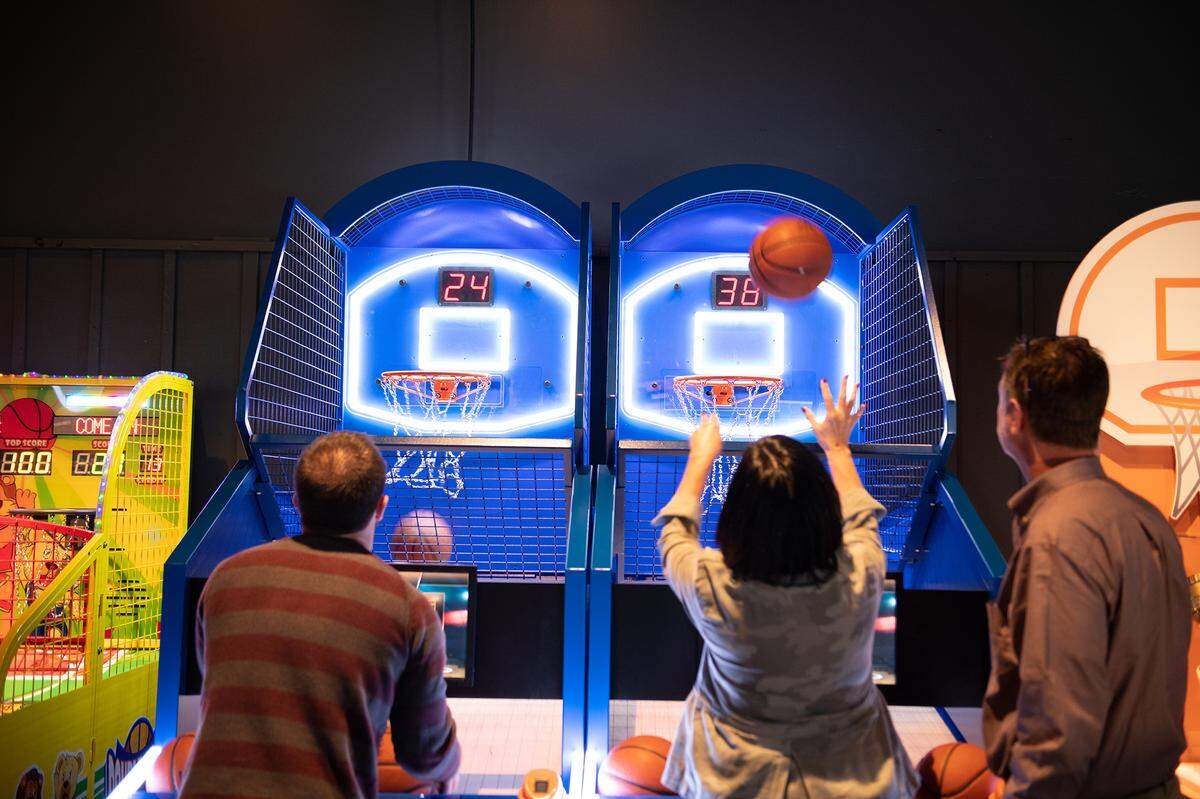 Guests vising The Science of Guinness World Records exhibit inside Union Station in Kansas City can play Pop-A-Shot basketball against each other.
