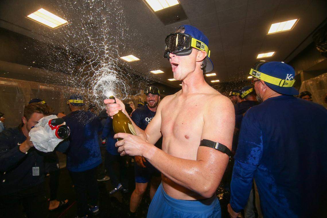 Kansas City Royals starting pitcher Brady Singer (51) celebrates after clinching a wild card playoff birth after a game against the Atlanta Braves at Truist Park.