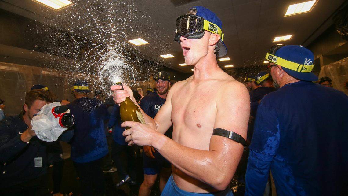 Kansas City Royals starting pitcher Brady Singer (51) celebrates after clinching a wild card playoff birth after a game against the Atlanta Braves at Truist Park.