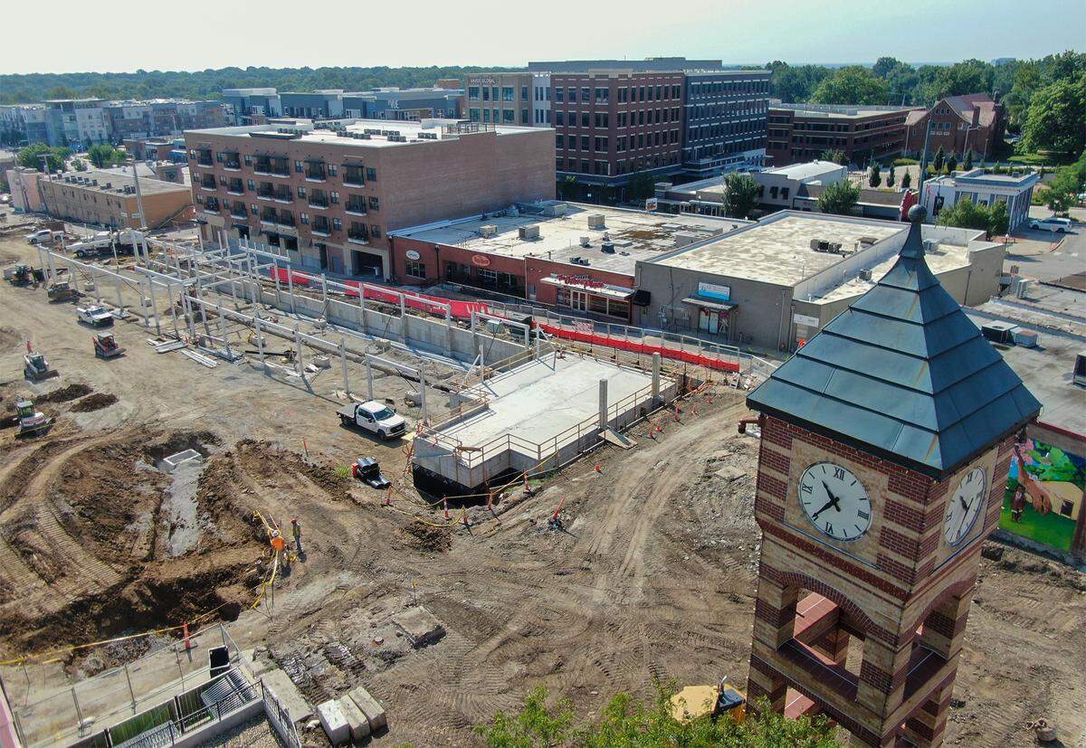 Construction work continues on a new pavilion for the new Farmers Market and Downtown Gathering Space Improvement project on Friday, Aug. 15, 2025, in downtown Overland Park. The $34 million project includes a space for watch parties, concerts and other community events, is slated for completion in the summer of 2026.  The new structure replaces the original one built in 1991. 