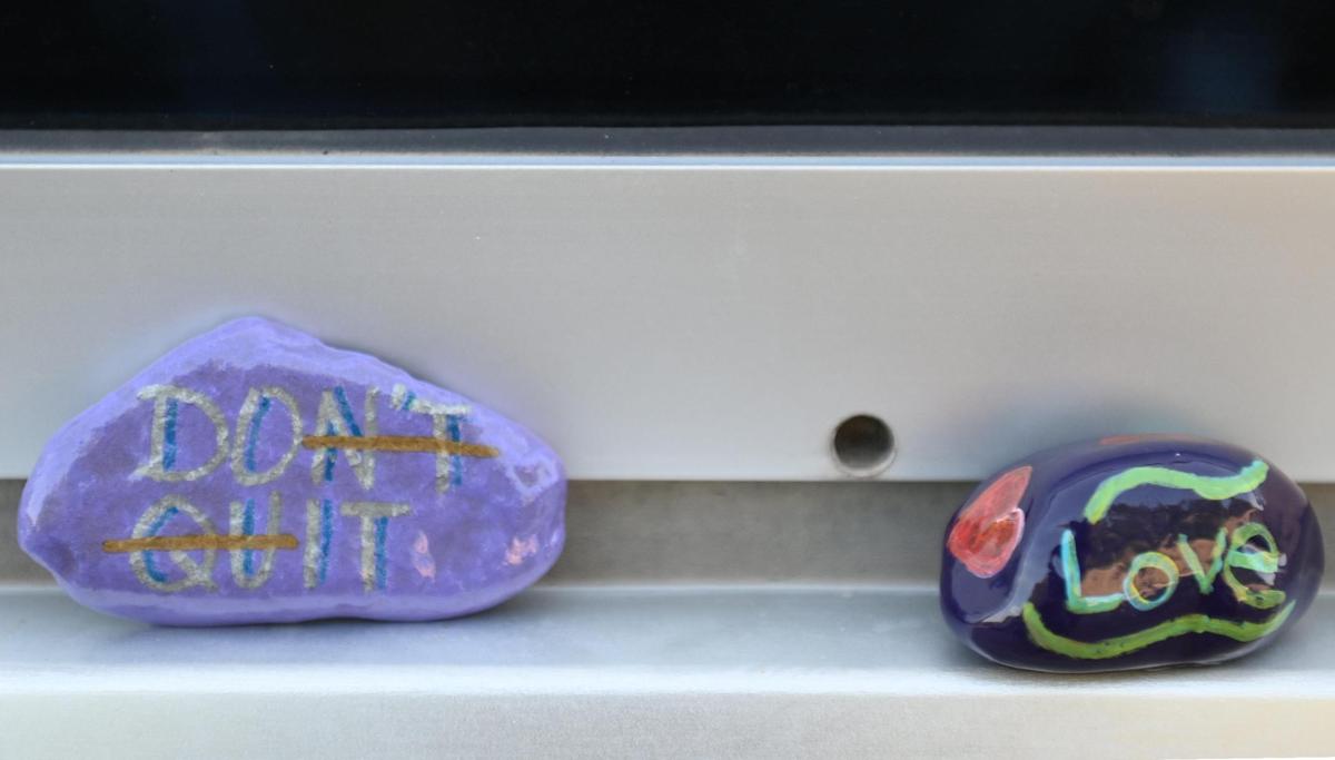 April Shaver left rocks painted with the messages “Don’t Quit” and “Love” during a visit to see her mother, Gwen Starkey, a COVID-19 patient at a long-term care hospital in Kansas City.
