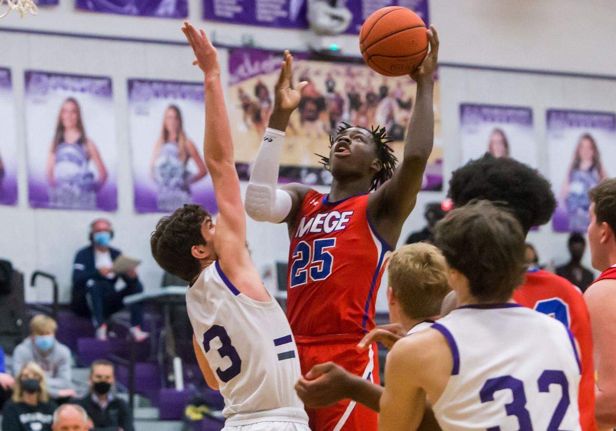 Bishop Miege’s Mark Mitchell Jr. goes up for a score against Blue Valley Northwest at BV Northwest on Friday Feb. 26, 2021.