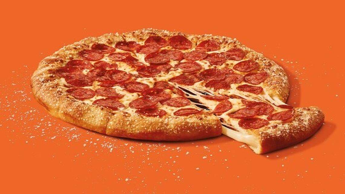Little Caesars is rolling out a revamped version of its popular stuffed crust pizza featuring garlic butter and parmesan cheese.