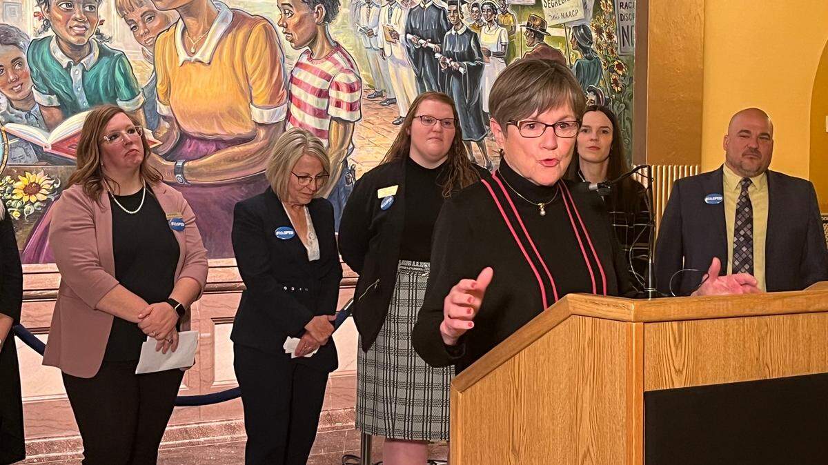 Kansas Gov. Laura Kelly speaks at a press conference hosted by former Kansas teachers of the year.