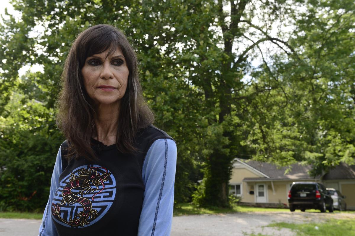 Kathy Zeysing is pictured outside the house in south Kansas City where her friend Wanda Conkling and William Cadwalader were killed in 1979. Robert Gross was a suspect in the killings but has never been charged.