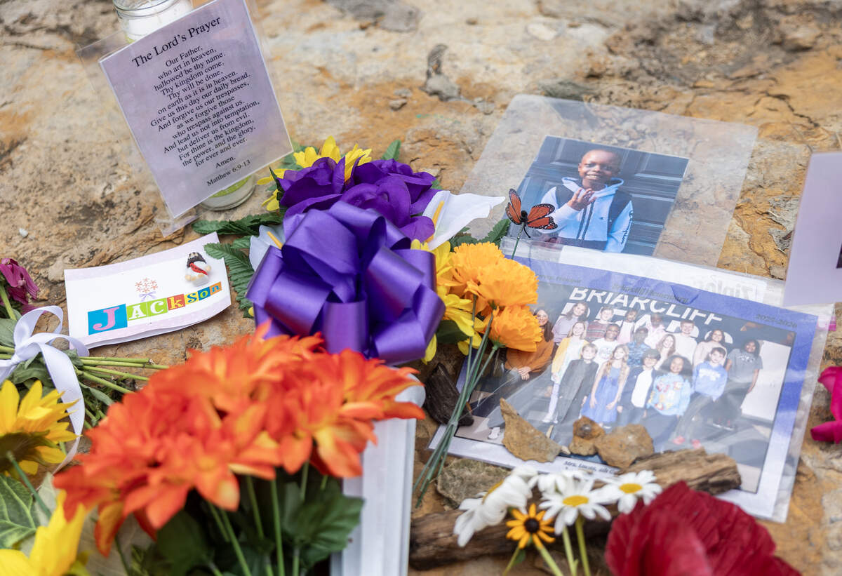 A small memorial was set up at a pond in Kansas City’s Briarcliff neighborhood where the body of 10-year-old Jackson Georgari was found on Thursday, July 9.