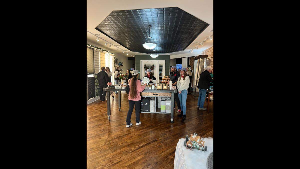 Budget Blinds, pictured here during an open house, has been in business for more than two decades.