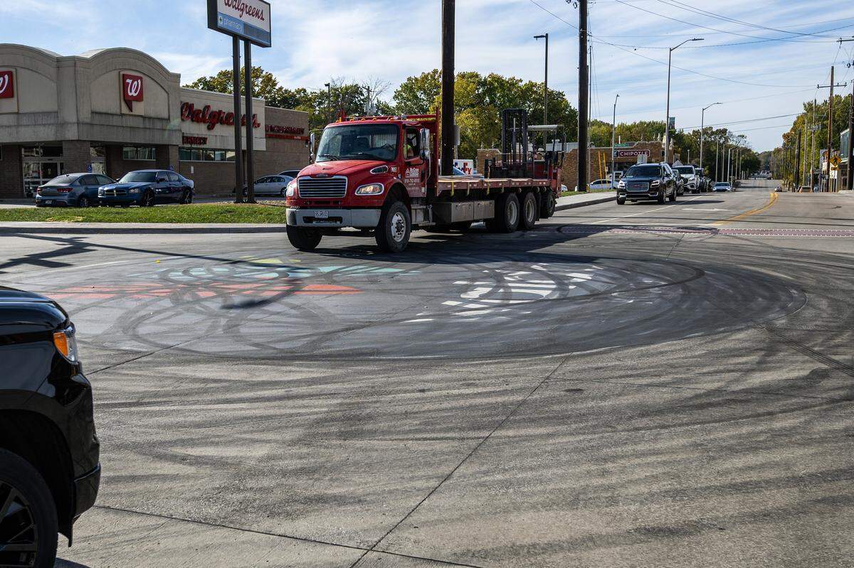 The street art logo in the middle of the intersection of 75th Street and Wornall Road is seen on Tuesday, Nov. 4, 2025, in Kansas City. The recently placed logo which celebrates the Waldo neighborhood was damaged by tire skid marks from an illegal sideshow over the weekend.