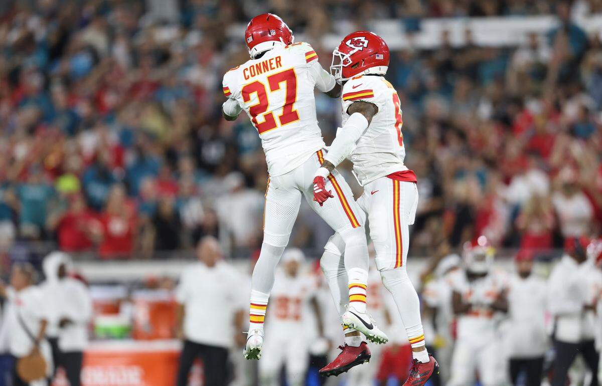 Kansas City Chiefs defensive backs Chamarri Conner (No. 27) and Bryan Cook celebrate a stop during an NFL game against the Jaguars at EverBank Stadium in Jacksonville, Florida on Monday, Oct. 6, 2025.