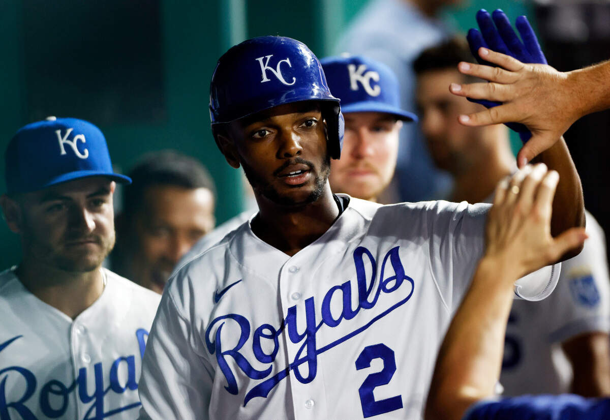 Kansas City Royals outfielder Michael A. Taylor is congratulated in the dugout after hitting a home run during the fifth inning against the Seattle Mariners at Kauffman Stadium in Kansas City, Mo., Saturday, Sept. 18, 2021. 