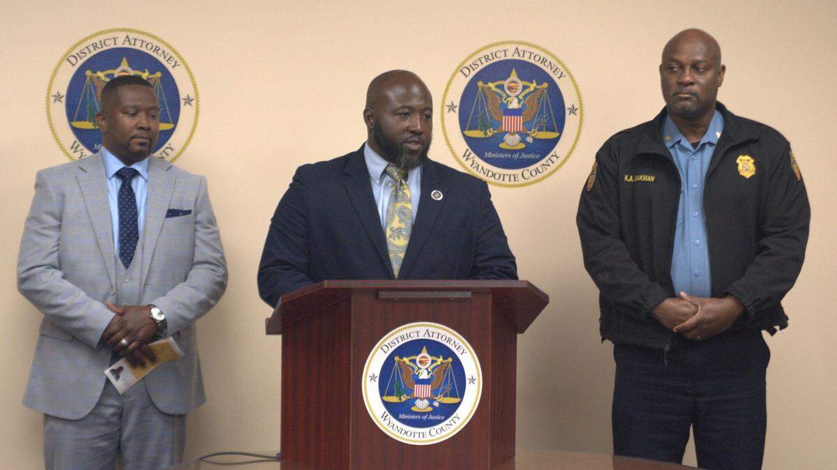 Wyandotte County District Attorney Mark Dupree, center, on Tuesday, July 16, 2024, announced a new program funded by a federal grant that aims to provide greater assistance to victims of gun violence. He was joined by program administration partners Damon Daniel, executive director of the Ad Hoc Group Against Crime, left, and Kansas City, Kansas Police Chief Karl Oakman, right.