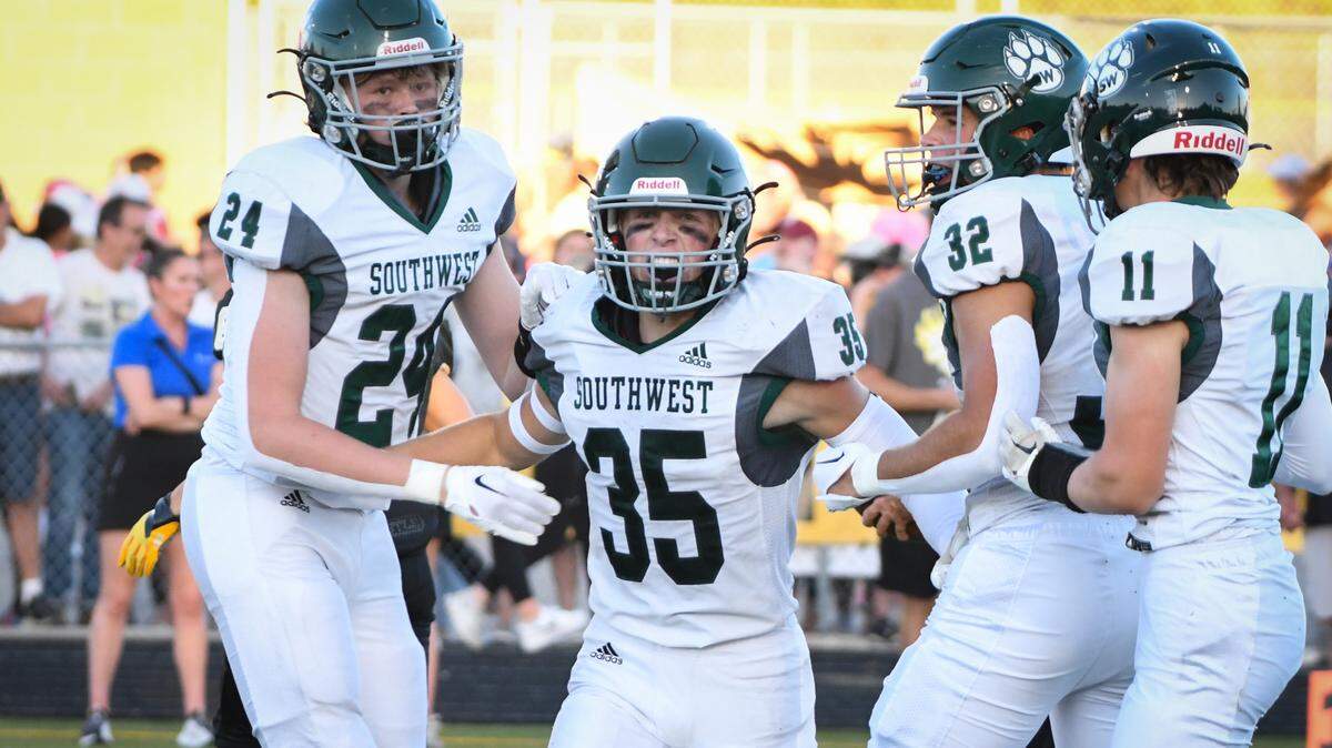 Blue Valley Southwest linebacker Gavin Grant (No. 35) celebrates with teammates during their 33-19 win over Blue Valley.