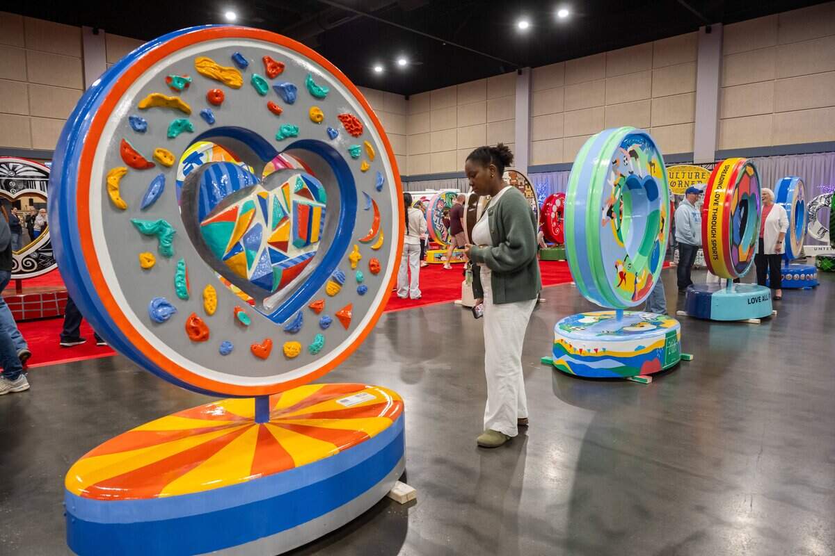 Thousands of people attend the first public exhibition of the new Parade of Hearts titled “150 United,” on Saturday, April 4, 2026, in Overland Park. The hearts will begin to be placed around the Kansas City metro area over the next few months.