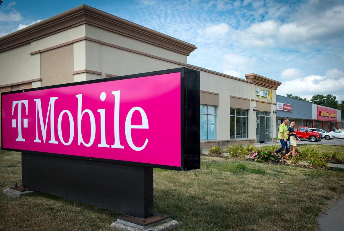 Signs for T-Mobile, which recently acquired Overland Park-based Sprint Corp., are beginning to show up at former Sprint stores, including this one at 5390 Johnson Drive in Mission.