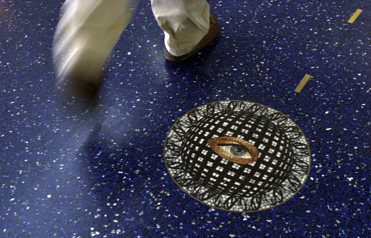 The blue terrazzo floors in the terminals at Kansas City International Airport featured mosaic medallions inset into the floor, giving travelers a reason to look down as they passed through the airport.