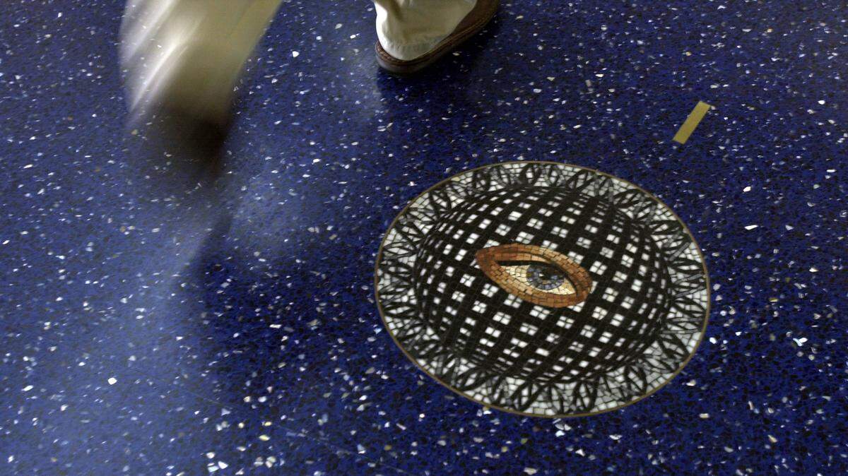 The blue terrazzo floors in the terminals at Kansas City International Airport featured mosaic medallions inset into the floor, giving travelers a reason to look down as they passed through the airport.