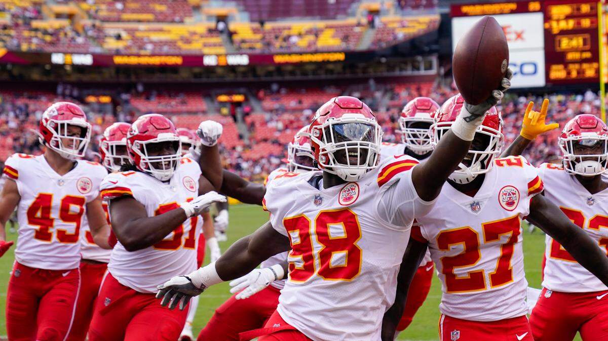 Kansas City Chiefs defensive end Tershawn Wharton (98) holds up the football as he celebration his interception against the Washington Football Team during the second half of an NFL football game, Sunday, Oct. 17, 2021, in Landover, Md. Chiefs won 31-13. (AP Photo/Alex Brandon)