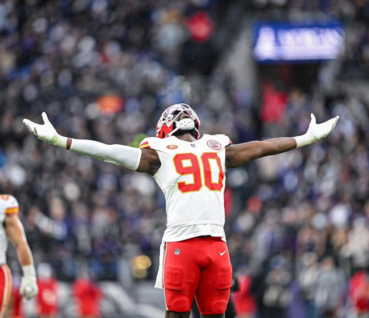 Kansas City Chiefs defensive end Charles Omenihu (90) celebrates forcing fumble out of the hands of Baltimore Ravens quarterback Lamar Jackson (8) in the second quarter Sunday, Jan. 28, 2024, during the AFC Championship Game in Baltimore.