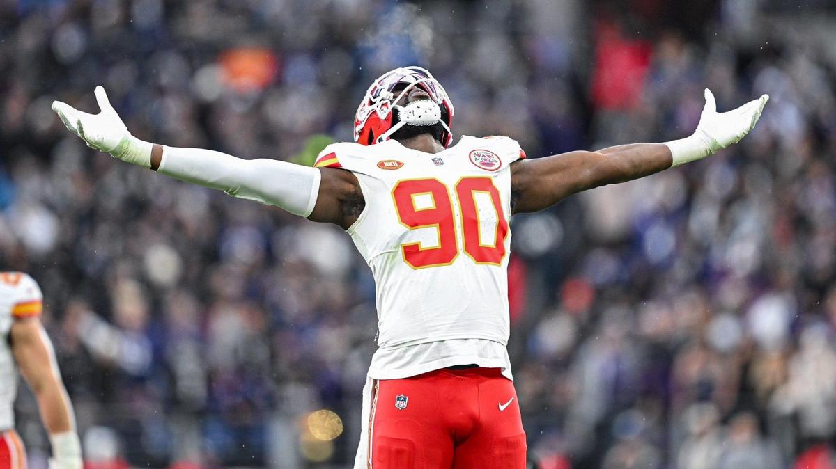Kansas City Chiefs defensive end Charles Omenihu (90) celebrates forcing fumble out of the hands of Baltimore Ravens quarterback Lamar Jackson (8) in the second quarter Sunday, Jan. 28, 2024, during the AFC Championship Game in Baltimore.