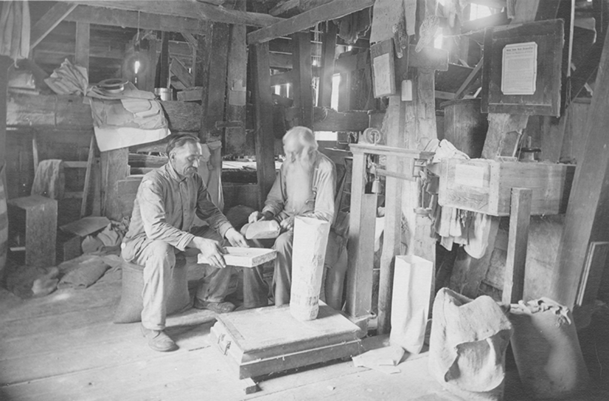 Edgar Watts (left) and his father Stubbins (right) at work in Watts Mill, 1921.
