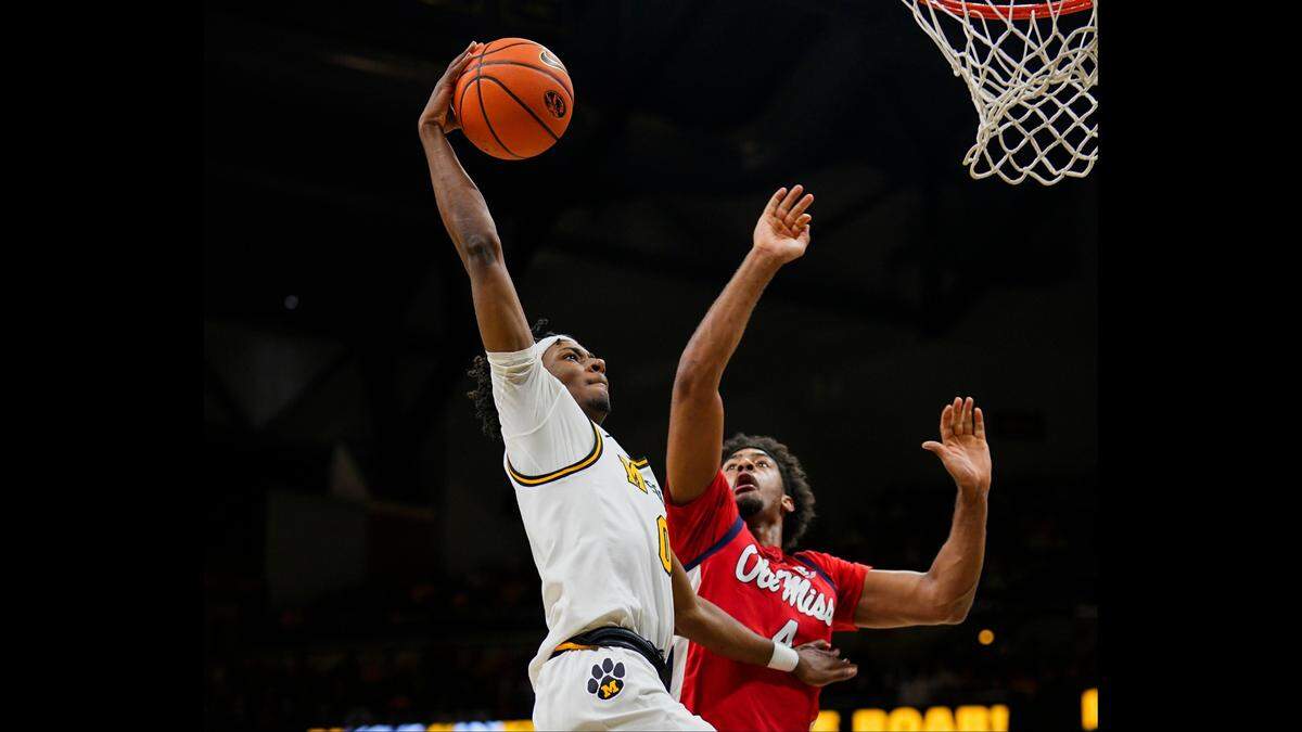Missouri Tigers guard Anthony Robinson II shoots over Mississippi Rebels forward Jaemyn Brakefield during an SEC men’s basketball game at Mizzou Arena in Columbia, Mo., on Saturday, Jan. 25, 2025.