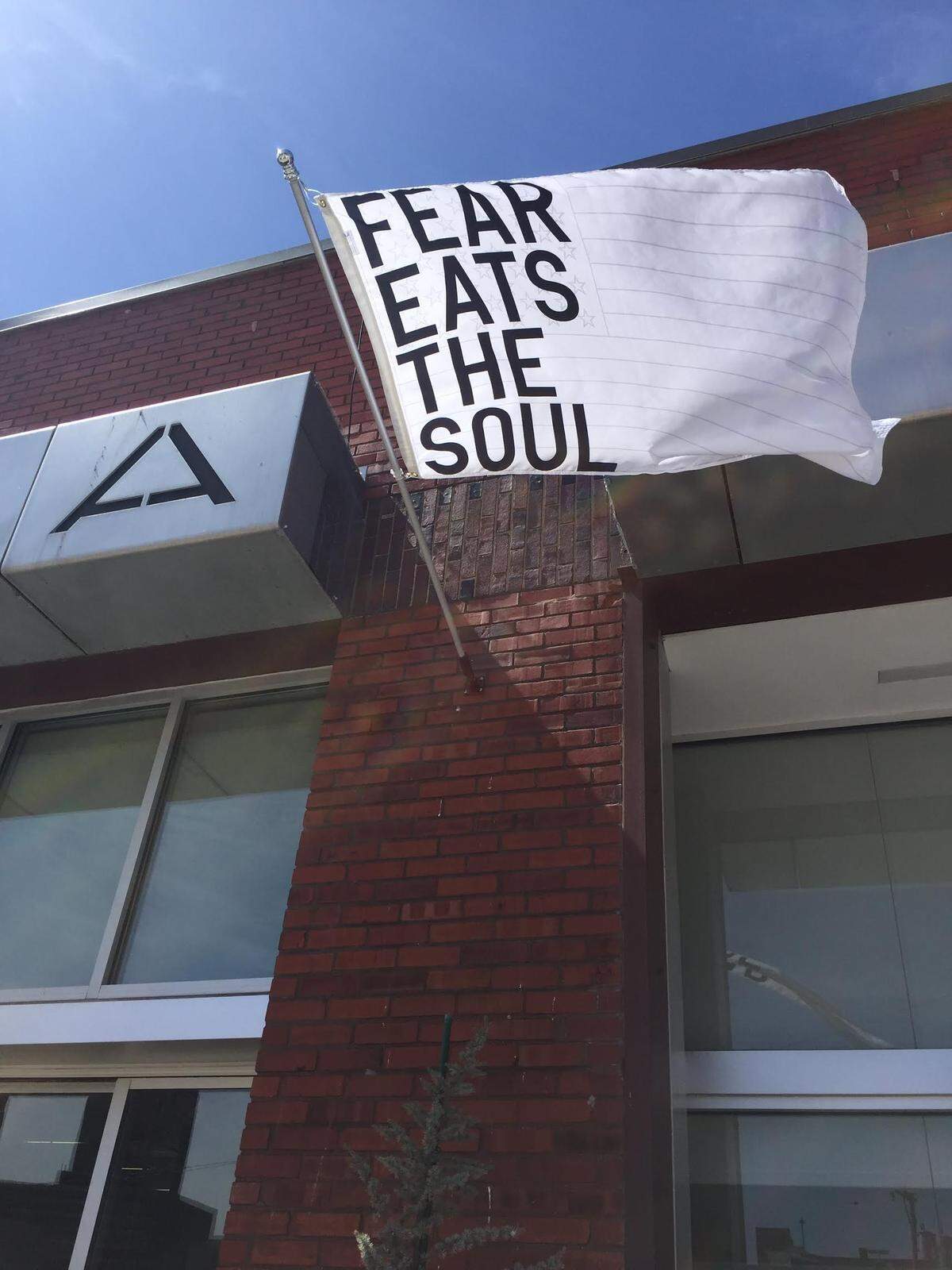 “Untitled 2017 (fear eats the soul) (white flag)” by Rirkrit Tiravanija was displayed at the Mid-America Arts Alliance building in the KC Crossroads as part of the “Pledges of Allegiance” public arts project.