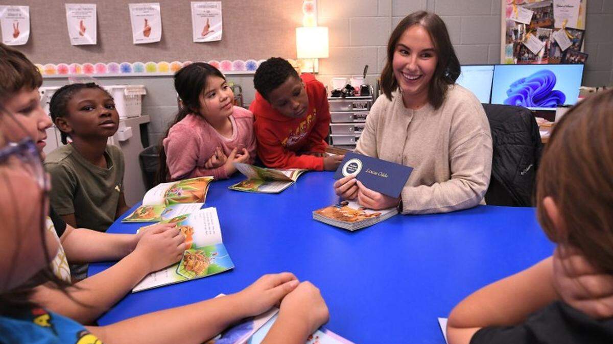 Lexcee Oddo shows her Milken Educator Award to her students at Turner Elementary School. Oddo was among 30 teachers nationally to recieve the designation from the Milken Family Foundation this school year.