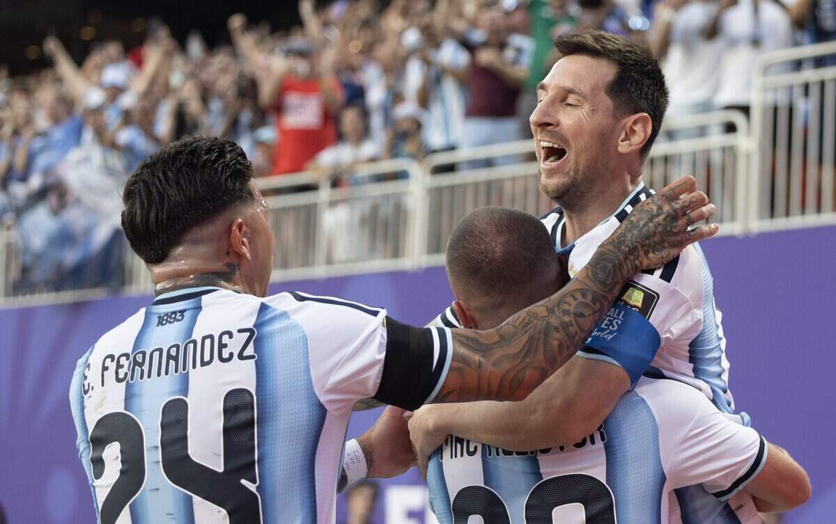 Argentina forward Lionel Messi (10) celebrates with teammate Argentina midfielder Alexis Mac Allister (20) and Argentina midfielder Enzo Fernández (24) after Messi kicked a corner that Mac Allister converted to a goal during the FIFA World Cup quarterfinal match at Kansas City (Arrowhead) Stadium in Kansas City on Saturday, July 11, 2026.