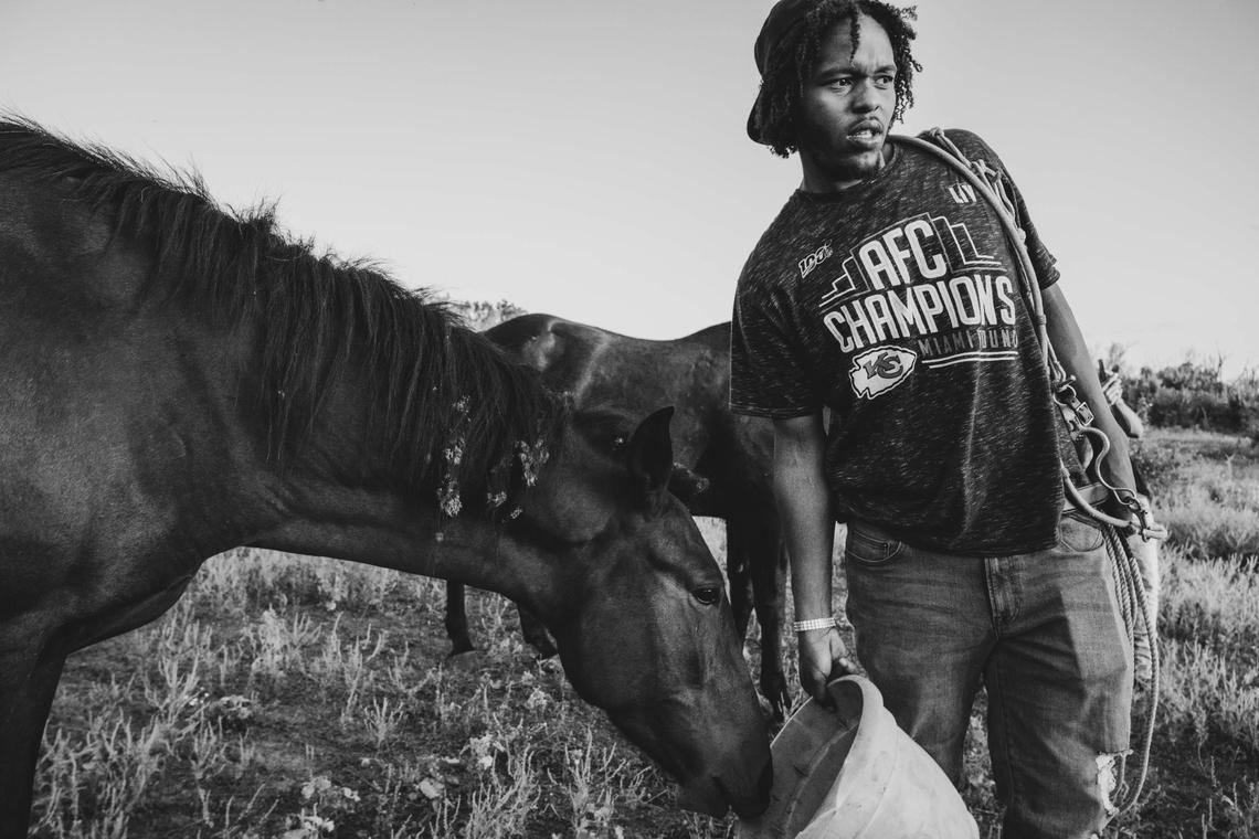 Simeon Brooks, aka CB Otto, holds a feed bucket for one of the horses at the Copper Boyz Ranch. Brooks grew up on a ranch as a young child, something that the rest of the kids in his class didn’t understand. “They didn’t understand that when I left school, I still had to go home to work on the farm, but this is all I know.”