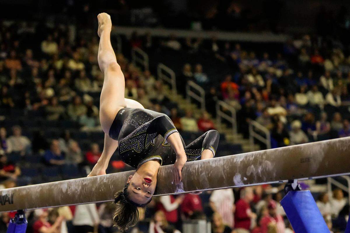Missouri Tigers gymnast Helen Hu competes on the balance beam during the SEC Gymnastics Championship at Gas South Arena on March 18, 2023.
