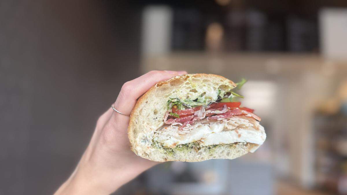 La Fetta’s Queen sandwich has turkey, bacon, fresh mozzarella, fresh walnut pesto, pepperoncini, piquillo peppers and basil.