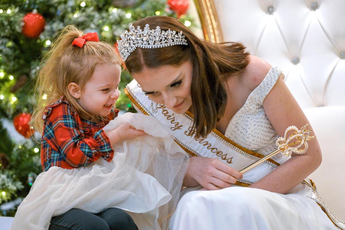 The Fairy Princess, also known as Olivia Pikul, 23, listened as Eloise Newberry, 3, of Gladstone, Missouri, shared her Christmas wish with her during a visit Dec. 8 at the Betty Milbank Waldrop Salon at the Kansas City Museum. The holiday tradition traces its beginnings to 1935 at Kline’s Department Store.