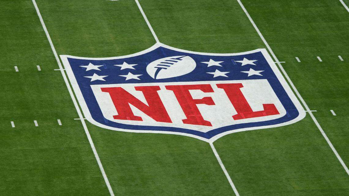 Feb 12, 2023; Glendale, AZ, USA; A general view of the NFL shield logo on the field before Super Bowl LVII between the Kansas City Chiefs and Philadelphia Eagles at State Farm Stadium.