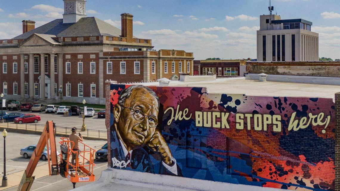 Graffiti artist and muralist ARCY in October 2021 took a look at his work on an over-sized mural of former President Harry S. Truman and his famous saying on the side of a building on the Independence Square.