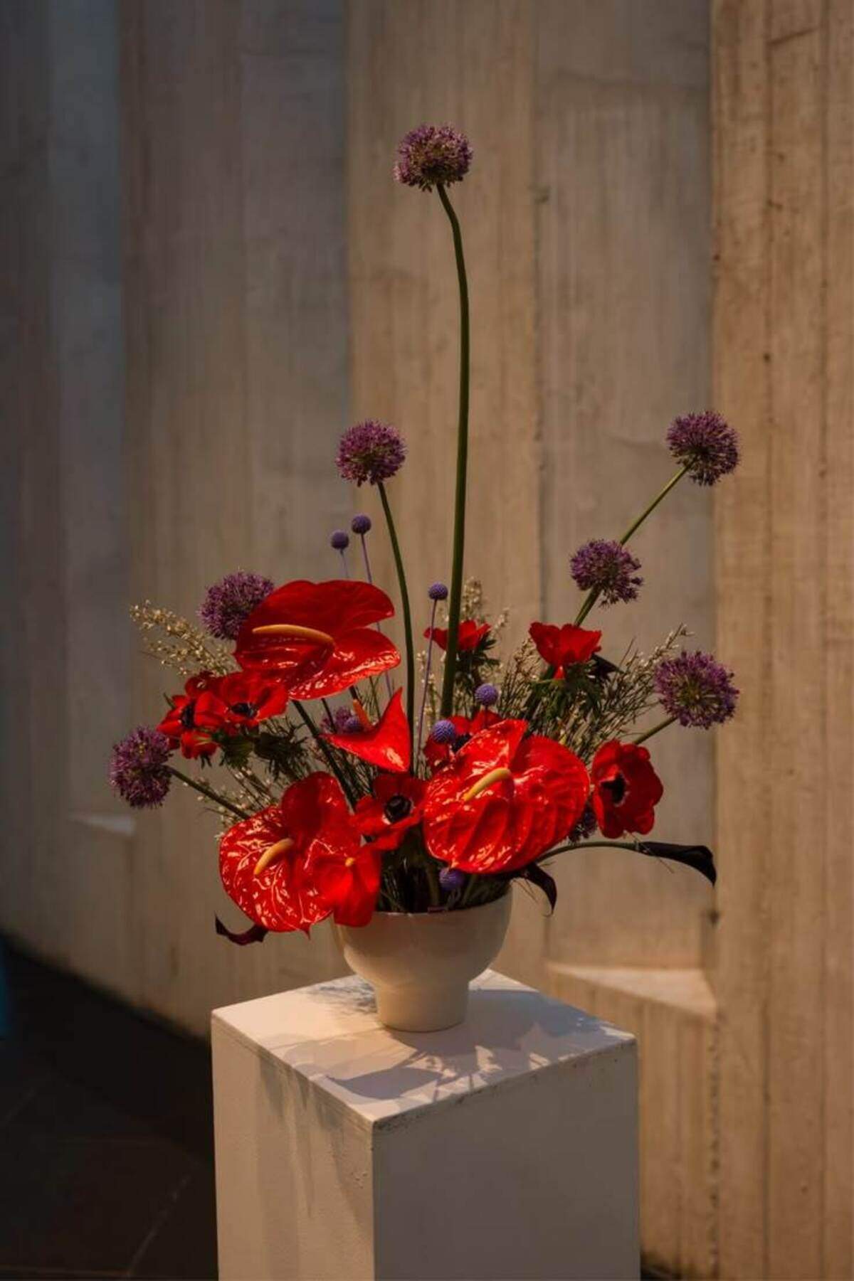 An arrangement of red anthurium that uses colors Burch envisions for Swift’s wedding.