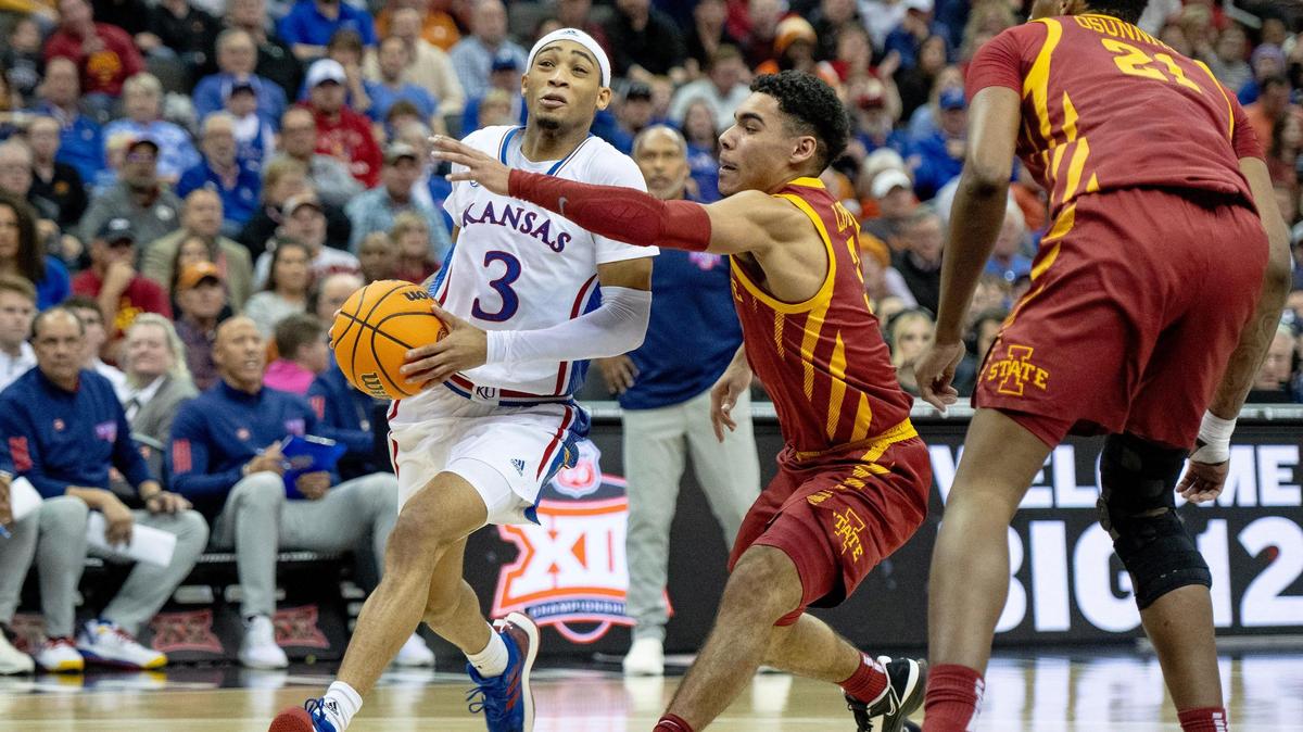Kansas guard Dajuan Harris Jr. (3) drives to the hoop against Iowa State guard Tamin Lipsey (3) during the semifinal round of the Big 12 Conference tournament Friday, March 10, 2023, in Kansas City.