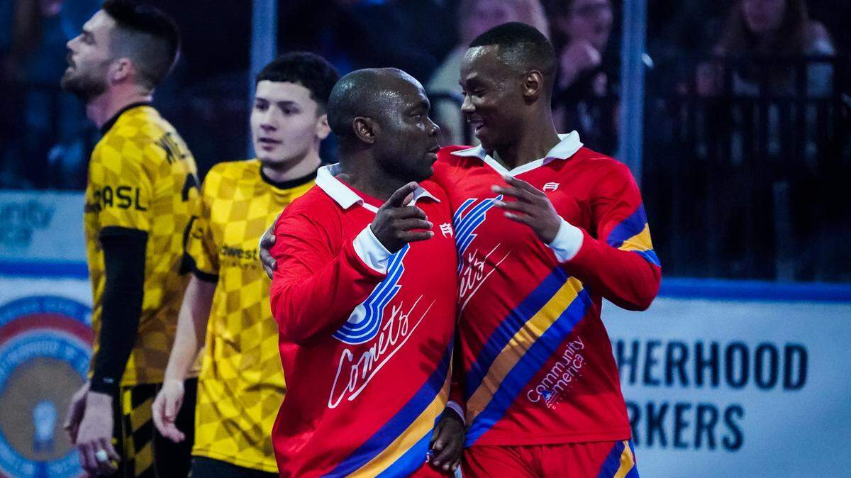 Leo Gibson (left) and Lesia Thetsane (right) celebrate a goal on Retro Night during Saturday’s 10-4 win over the Milwaukee Wave.