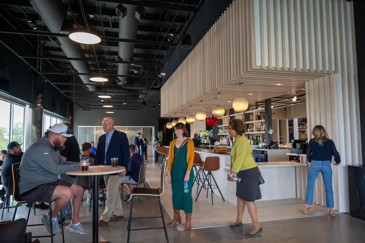 Guests tour the members’ lounge at Homefield Kansas City.