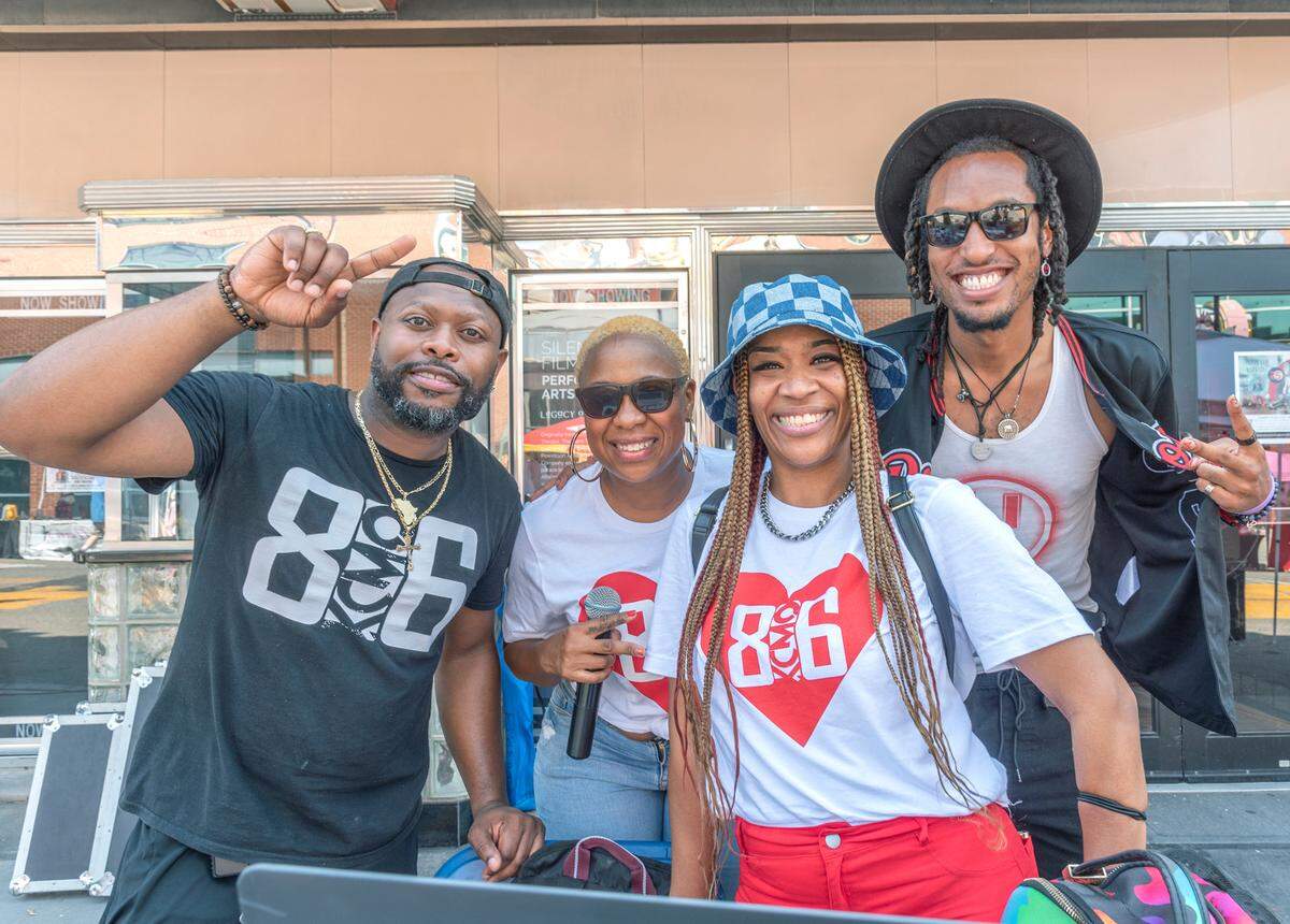 “Bizzy” Benton, from left, posed with some of his 816 Day talent: emcee and host Cherayla Hanes, DJ Missy E and musical performer Aaron “AY” Young.