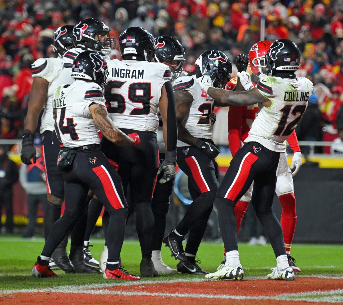 Houston Texans wide receiver Nico Collins (12) celebrates with his teammates after scoring a touchdown in the fourth quarter of their game against the Kansas City Chiefs at GEHA Field at Arrowhead Stadium on Sunday, Dec. 7, 2025, in Kansas City.