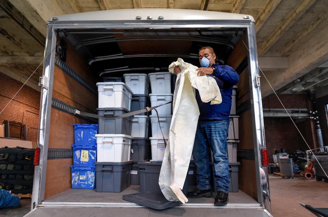Joseph Reyes of Truman Medical Center displays some of the items kept in emergency preparedness trailers spread throughout the Kansas City area. The trailers are stocked with cots, gloves, N95 masks, protective isolation clothing, blankets and other essentials.