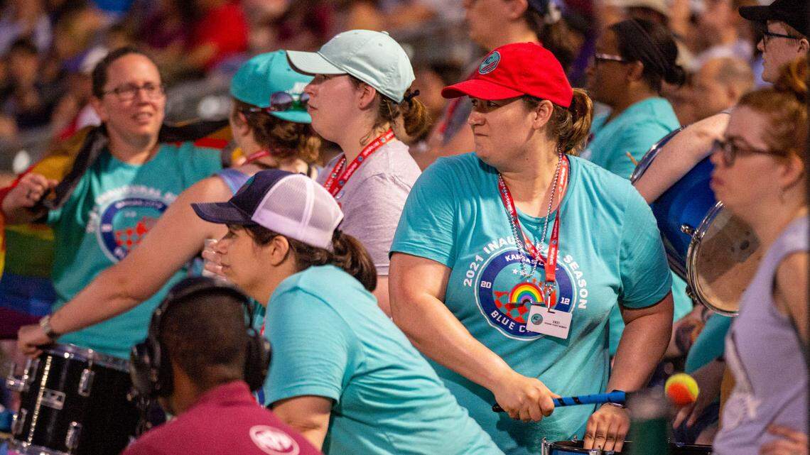 Blue Crew members Danielle Russell, leaning over in black and white cap, Anna Fowler and other fans cheered for KC NWSL in a match against the Washington Spirit on Saturday at Legends Field in Kansas City, Kan.