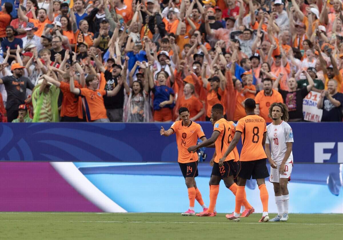 Netherlands players celebrate an early goal against Tunisia during a FIFA World Cup group-stage soccer match at Kansas City (Arrowhead) Stadium in Kansas City on Thursday, June 25, 2026.